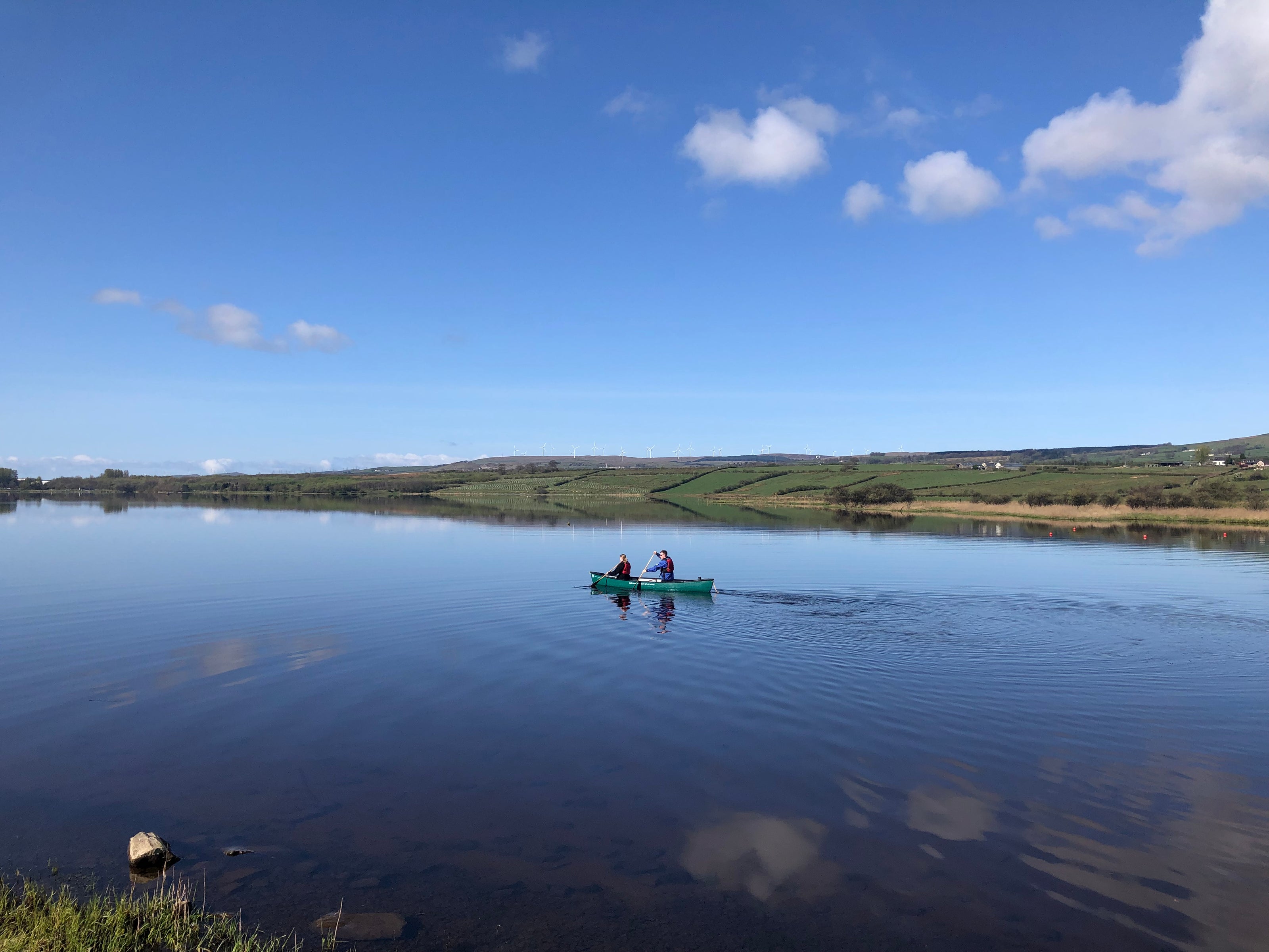 Garnock Canoe Club on water - blue sky